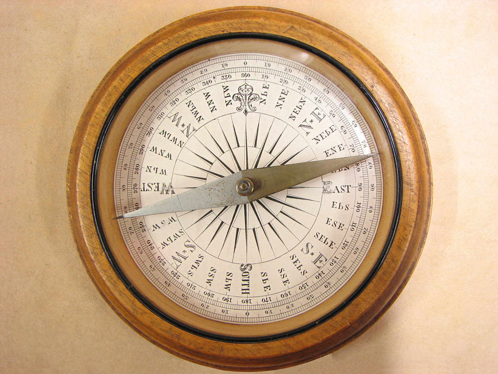 Late 19th century Francis Barker oak cased desktop compass with Trademark London logo